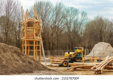 Playground Under Construction. Wood Log Playhouse Hut With Wooden Logs On Construction Site.  Building Children Playground At Park Or Urban Place.