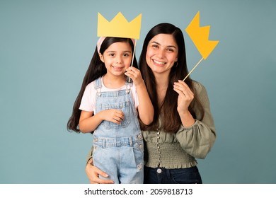 Playing To Be Queens. Hispanic Young Mom And Little Girl Having Fun While Wearing Princess Crowns