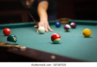 Playing billiard - Close-up shot of a man playing billiard - Shutterstock ID 337187525