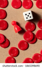 Playing Board Games Detail, Overhead Flat Lay Shot Of A Die With A Red Pawn And Pieces