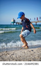 playing boy on the Baltic Sea beach of Zingst, Fischland-Darss peninsula, Mecklenburg-West Pomerania, Germany