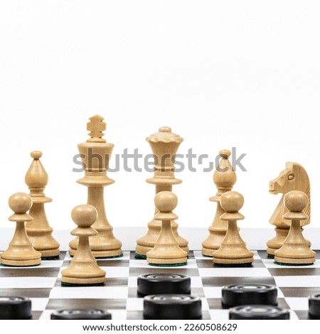 playing by different rules on the same board - black checkers and white chess figures on black white chessboard, white chess defends against black checkers (focus on the pawn defending the queen)