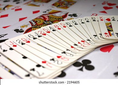 Playing cards background with focus on the Ace of Spades.