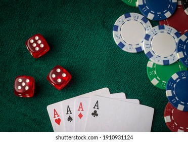 Playing Cards, Dice And Poker Chips From Above On The Green Poker Table