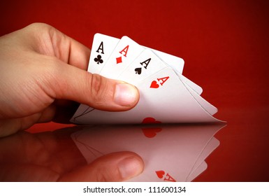 Playing Cards (four Of A Kind) In The Hand