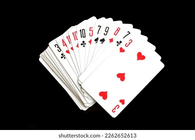 Playing cards lie on a black isolated background. - Powered by Shutterstock