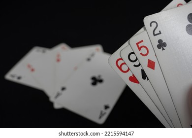 playing cards. no luck. bad alignment. black background