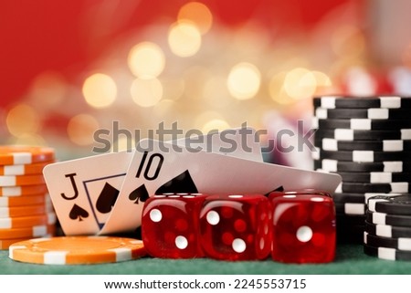 Playing cards on poker table background close up