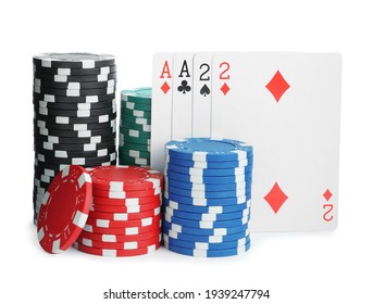 Playing Cards And Plastic Casino Chips On White Background. Poker Game