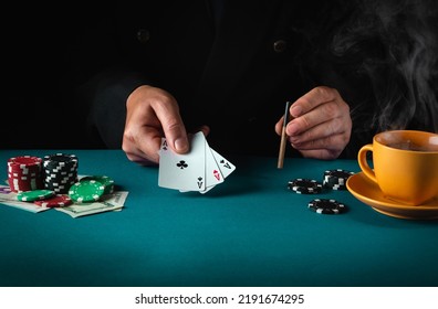 Playing cards with a winning combination in poker of three of a kind or set in the hand of a professional player. Success or fortune in the casino. - Shutterstock ID 2191674295
