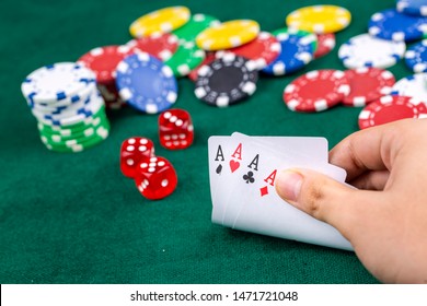 Playing Cards,dices And Poker Chips From Above On Green Poker Table