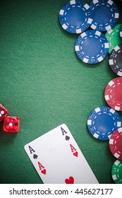 Playing Cards,dices And Poker Chips From Above On Green Poker Table