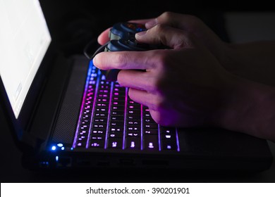 Playing Computer Game On Laptop With Joypad