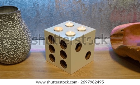 playing cube as a candlestick, a modern interior accessory