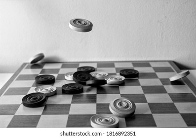 Playing Draughts - Black And White Image