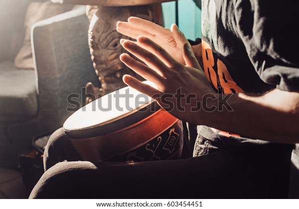 Playing the drum. Hands with a drum. another view.\
african, bang, beat, child, class, drum, drummer, fingers, hand,\
hit, instrument, kid, music, musical, percussion, play, rhythm,\
ring, sound.