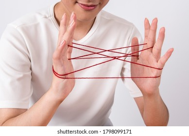 playing each other with thread