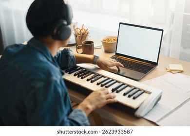 Playing Electronic Keyboard While Using Laptop at Desk