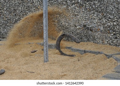 Playing Game With Grey Horseshoes