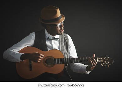 Playing guitar - Powered by Shutterstock