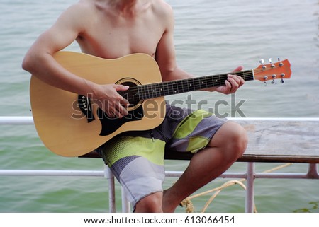 Similar – Young musician enjoying guitar on sunny day