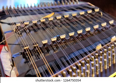 Playing A Hammered Dulcimer.