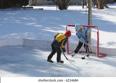 Playing Ice Hockey On An Outdoor Ice Rink