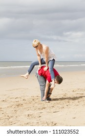 Playing Leapfrog On A Sandy Beach