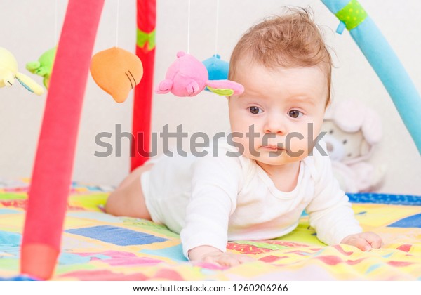 Playing Little Child On Colored Mat Stock Photo (Edit Now) 1260206266