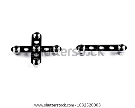 Playing math: + - built with meccano, with the effect of glossy black steel, slight slope. Isolated on white with shadows, front view