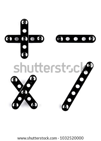 Playing math: + - * / are constructed with meccano, with the effect of glossy black steel, slight slope. Isolated on white with shadows