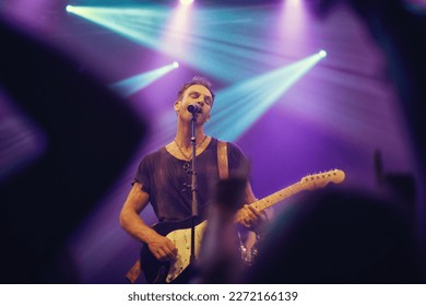 Playing from my soul. Musician playing guitar and singing at a gig. - Powered by Shutterstock