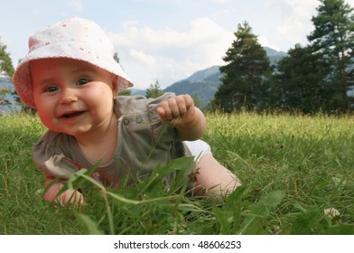 Playing In The Nature. Baby In Switzerland