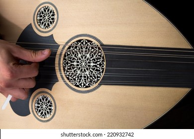 Playing Oud.