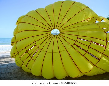 Playing Parasailing On Beach In Phuket, Thailand. Phuket Is A Heady Mix Of Bustling Bars, Night Spots, Restaurants And Truly Spectacular Dive Locations.