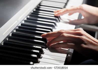 Playing Piano. Close Up