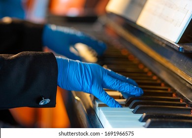 Playing the piano with protective gloves
