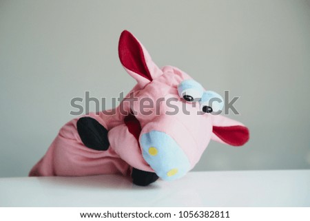 playing puppet on the white background. Pig. reaction. Emotional.