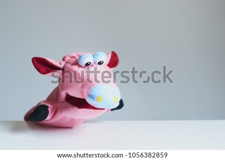 playing puppet on the white background. Pig. reaction. Emotional.