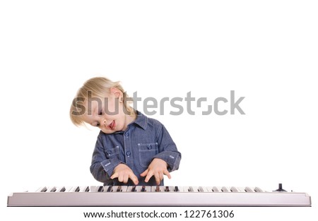 playing and singing little boy on black background