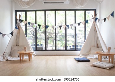 Playroom For Kids With Teepee And Small Drawing Tables