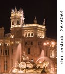 Plaza de Cibeles in Madrid, Spain at night.  With Cibeles Fountain and the Royal Mail office in the background (Palacio de Comunicaciones or Correos).