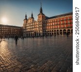 The Plaza Mayor, Madrid, with its colorful facades glowing in the warm light of the afternoon.