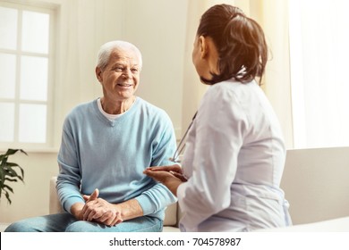 Pleasant cheerful man having a conversation - Powered by Shutterstock