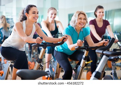 Pleasant elderly and young women working out hard in sport club - Powered by Shutterstock