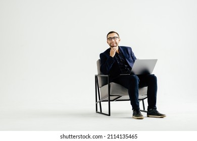 Pleasant positive business man using laptop - Shutterstock ID 2114135465