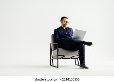 Pleasant positive business man using laptop - Shutterstock ID 2114135558