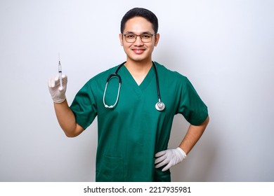 Pleasant smiling asian male doctor, physician in medical mask and gloves hold syringe with vaccine isolated over white background - Powered by Shutterstock