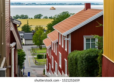 The Pleasant Town Of Granna With A Ferry On Lake Vättern In The Background. Sweden.