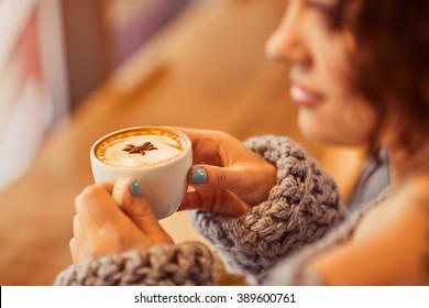 Pleasant woman drinking coffee  - Shutterstock ID 389600761